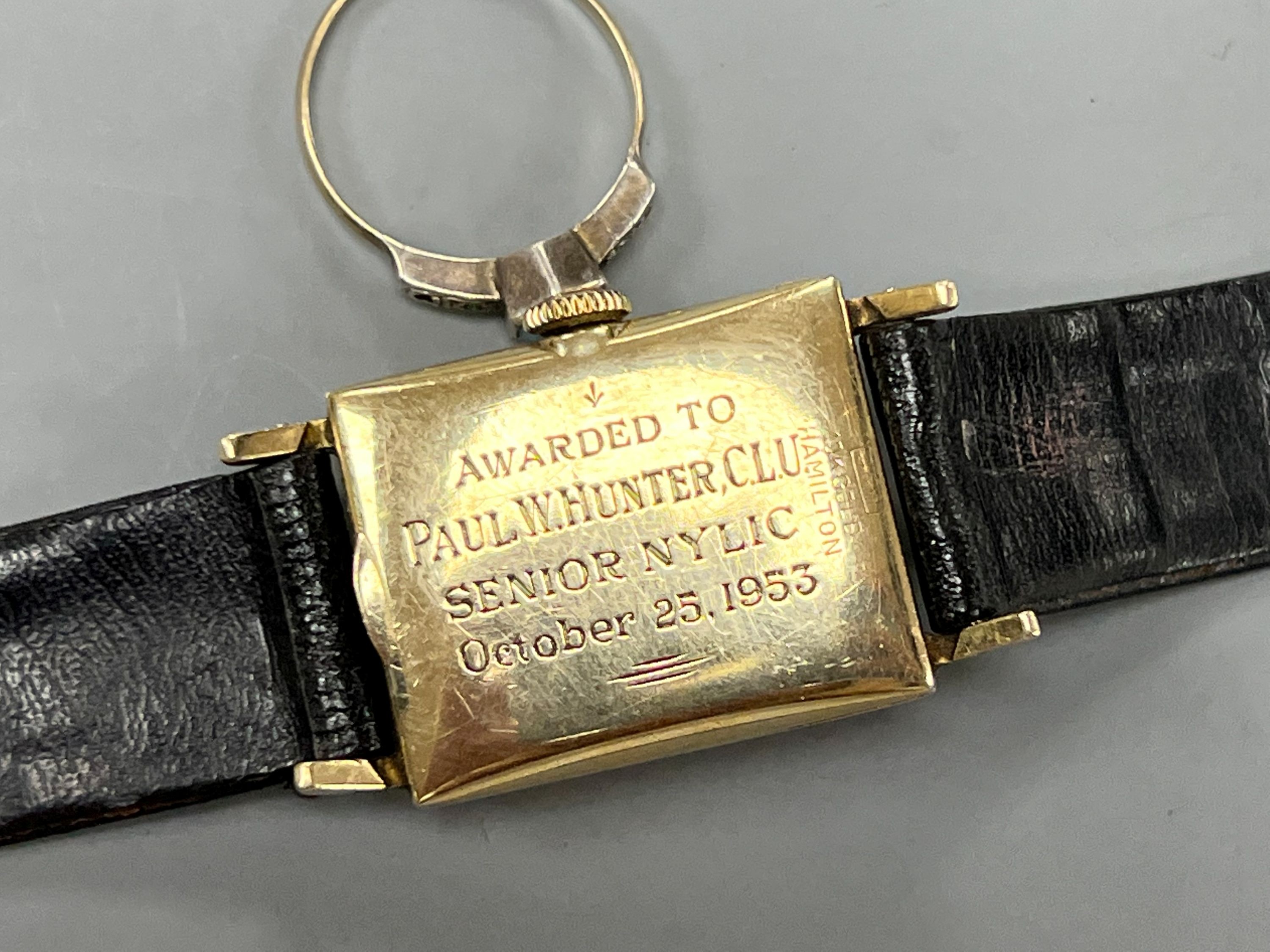 A gentleman's 10k yellow metal Hamilton manual wind wrist watch and a 9ct and white metal ring.